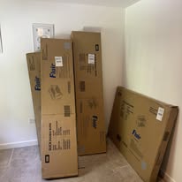 Flat-pack furniture boxes ready for assembly in an Aylesbury home