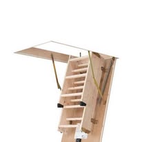 Wooden loft ladder with handrail extended from a ceiling hatch