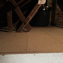 Close-up of completed loft floor boarding between timber joists