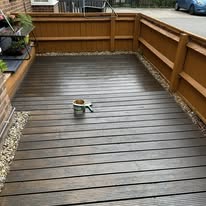 Freshly oiled timber decking and surrounding fence in an Aylesbury garden