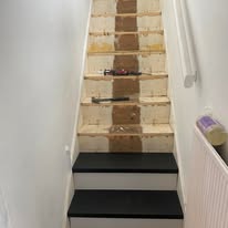 Staircase preparation in progress before decorative panel and finish work