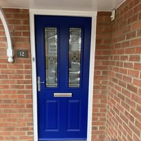 Bright blue glazed front door repainted with a clean exterior finish