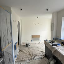 Room protected with dust sheets during a full house and flat renovation project